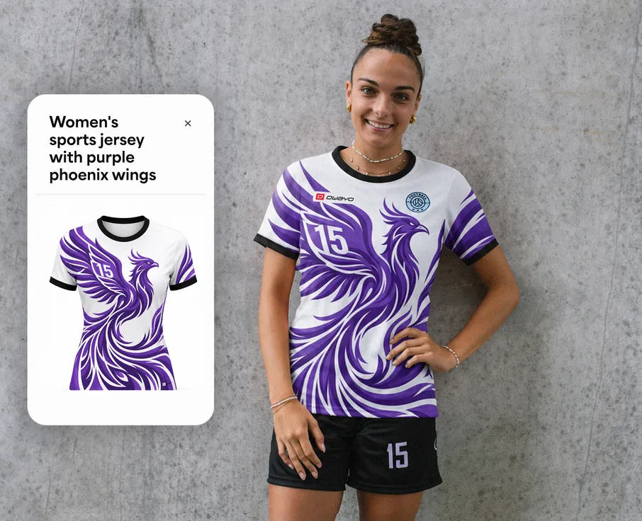 A woman is wearing a white sports jersey featuring a purple phoenix design and the number 15 while standing in front of a gray wall.